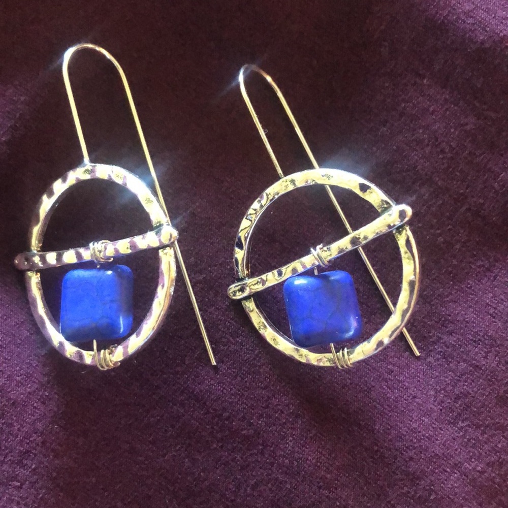 Silver earrings with blue stone.
